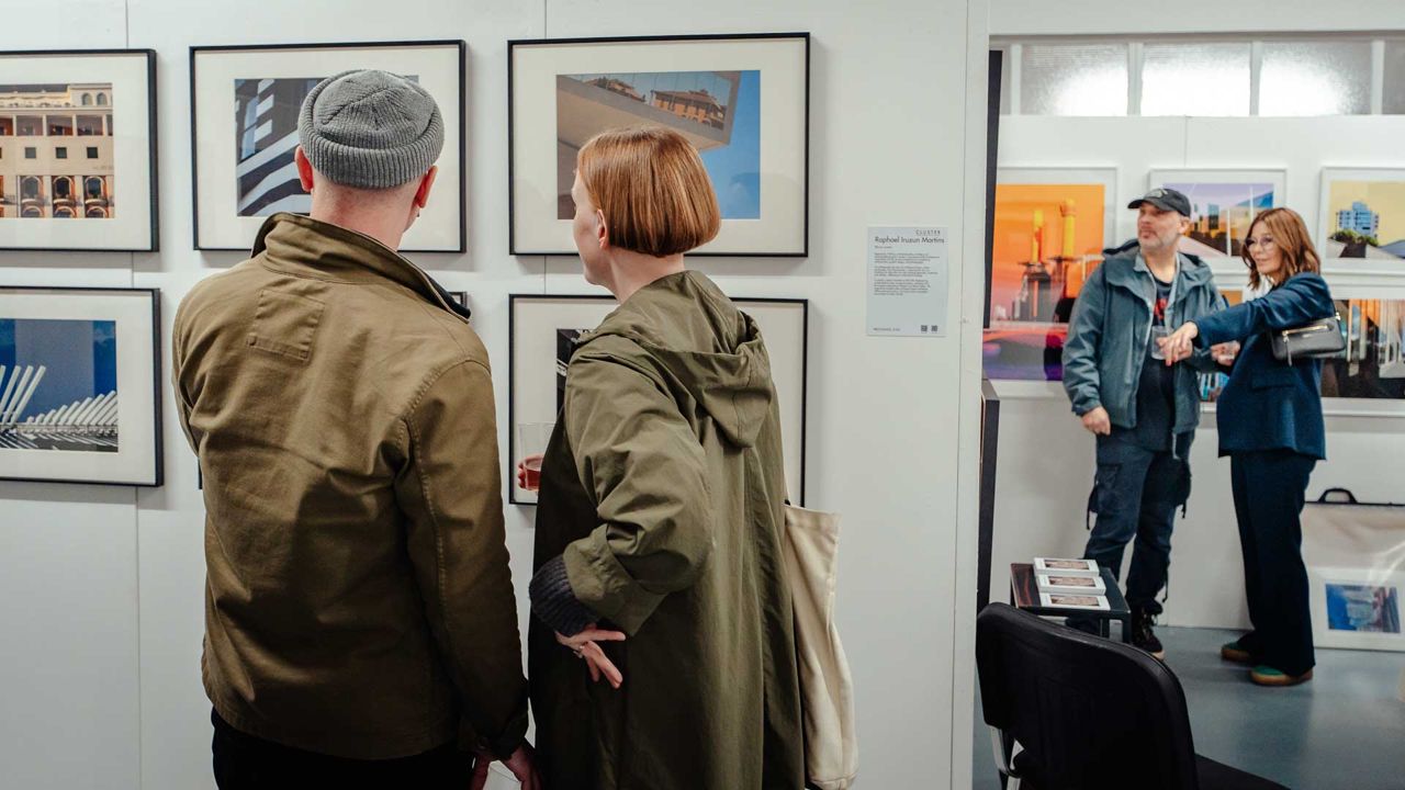 Visitors viewing work at a gallery exhibition