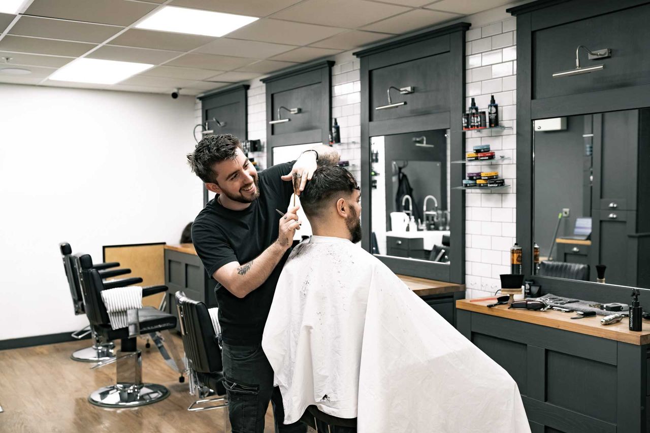 Barber at work, filmed on site in the shop