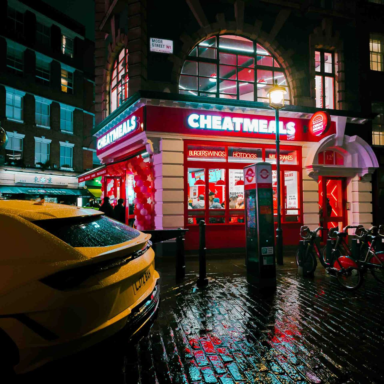 Restaurant frontage photographed after dark